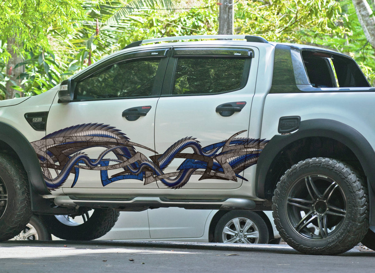 dragon tribal blue vinyl graphics on the side of pickup truck